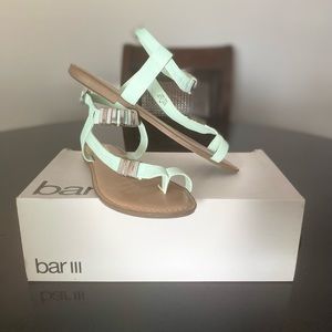 Bar III embellished flat sandals with buckle closure.